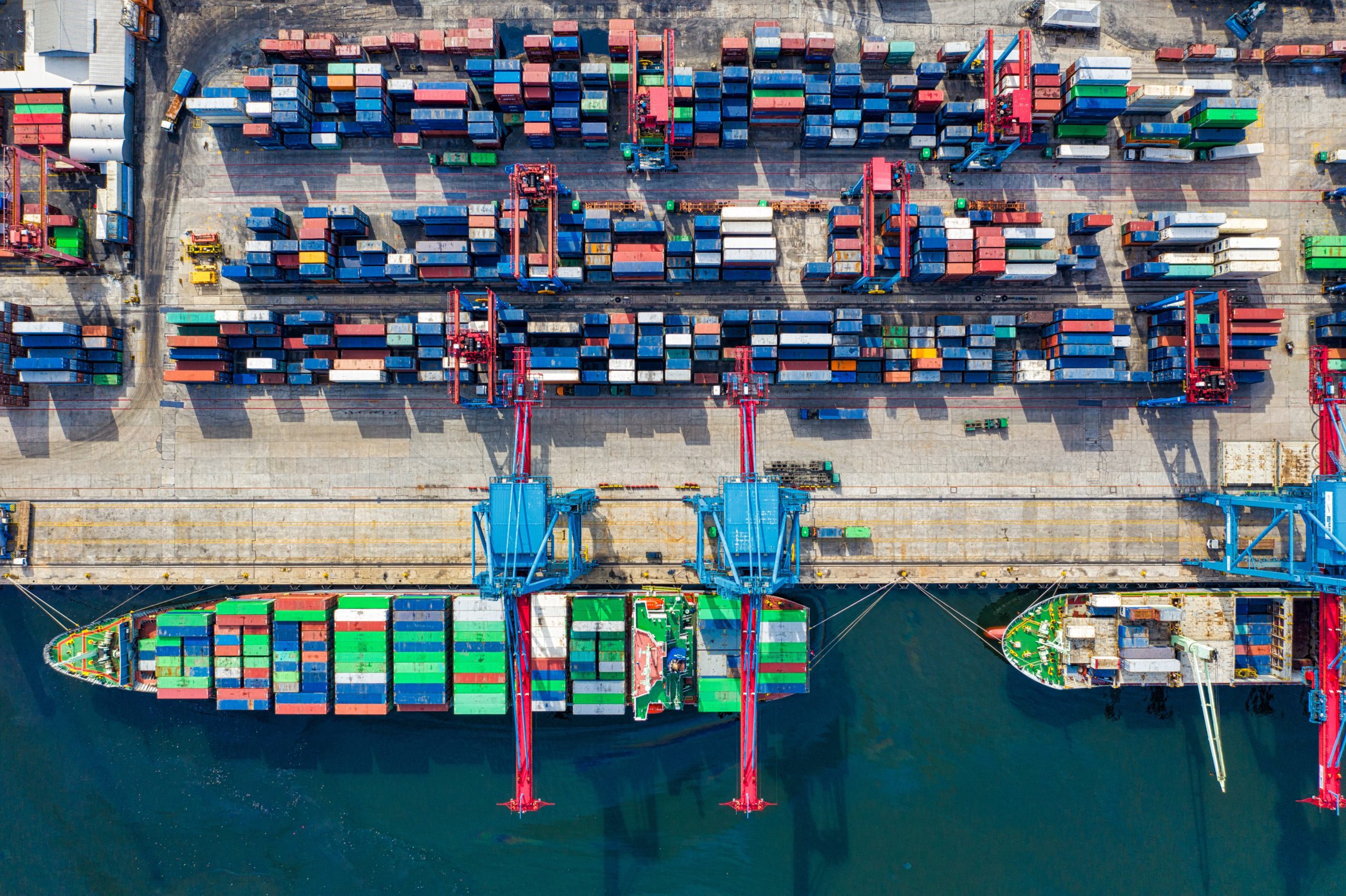 Photo of container ships docked at a port.