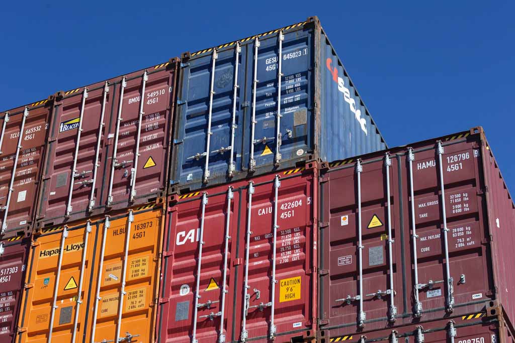 Stacks of colored intermodal containers on top of one another