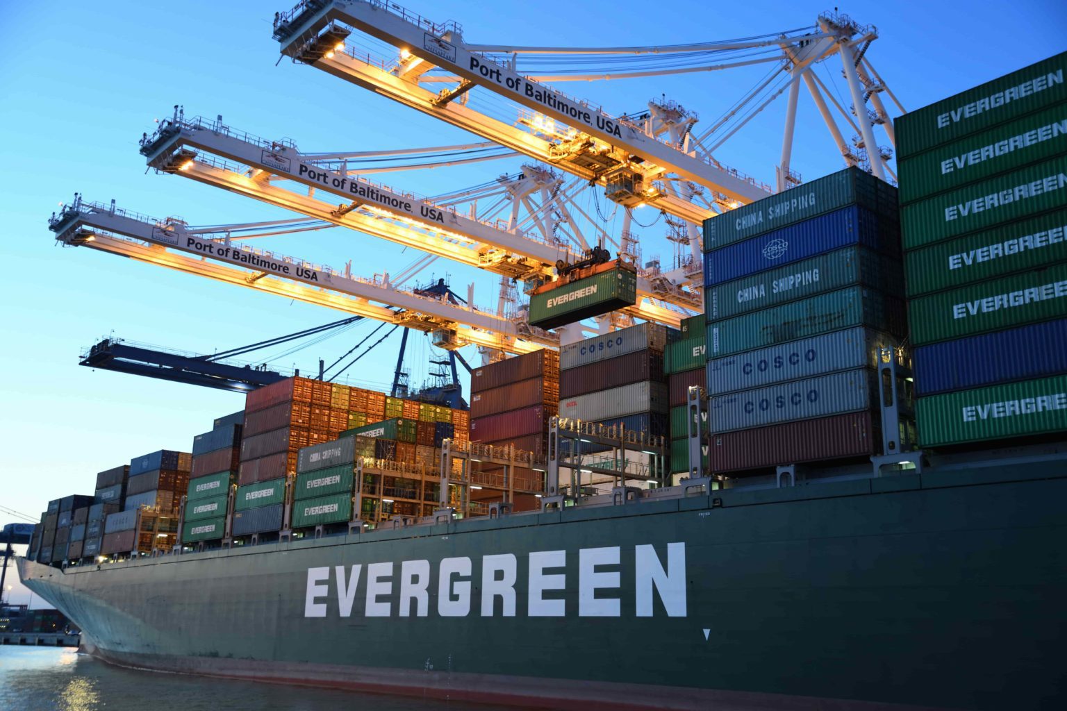 Photo of an Evergreen freight shipping vessel being unloaded at the Port of Baltimore.