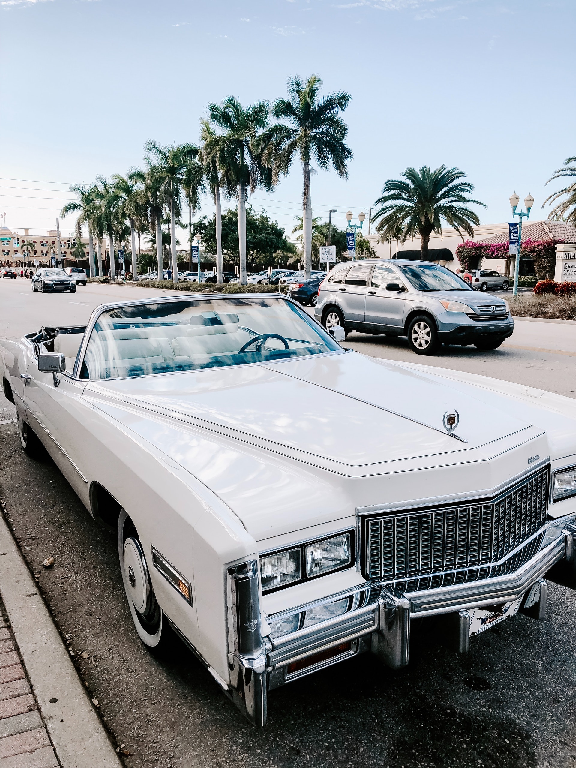 White classic muscle car parked on the street