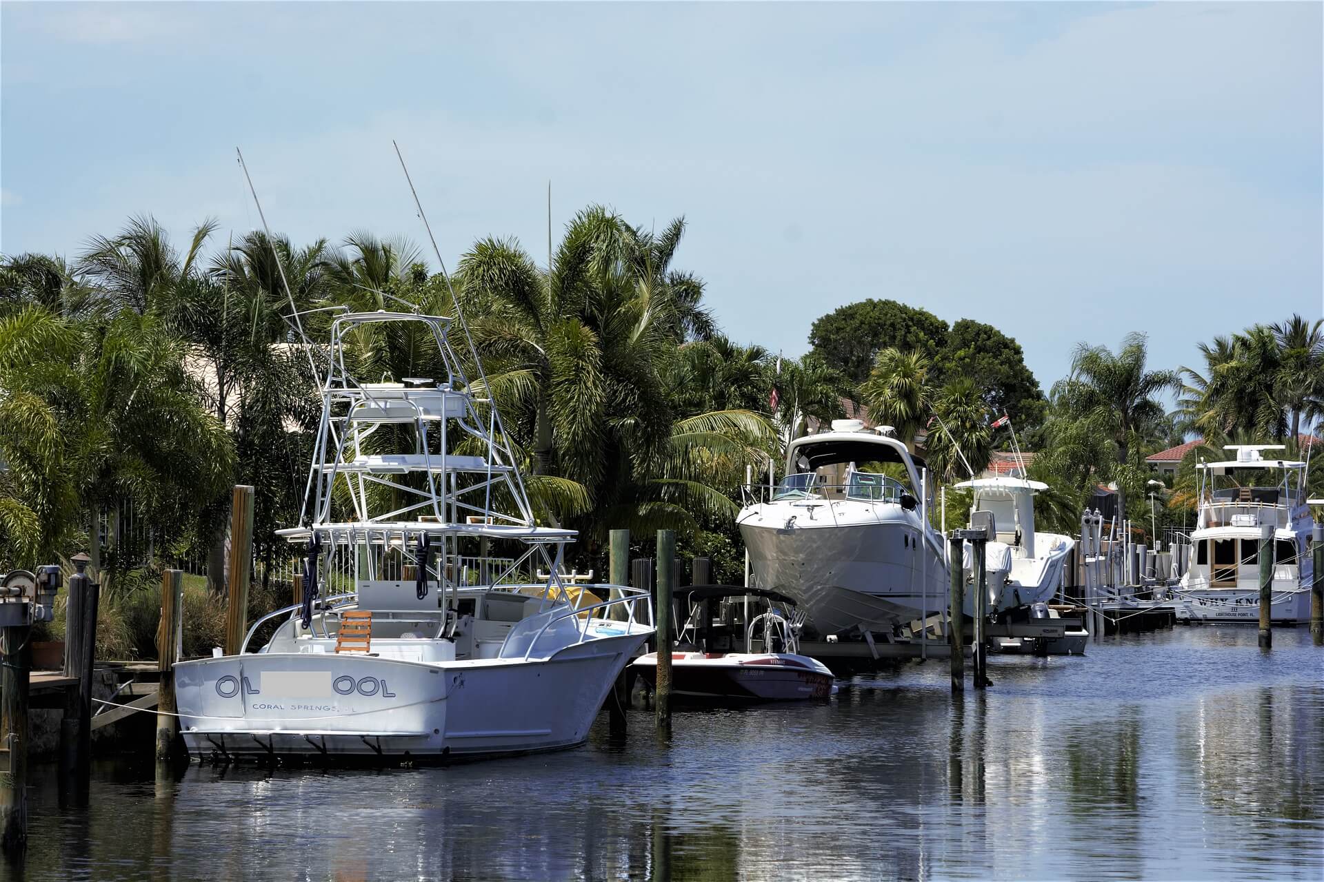 several yachts lined up on water