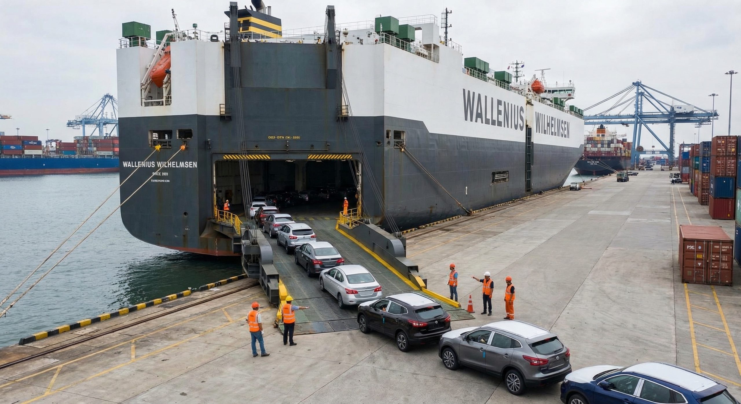 Vehicles being driven off RoRo vessel ramp at port